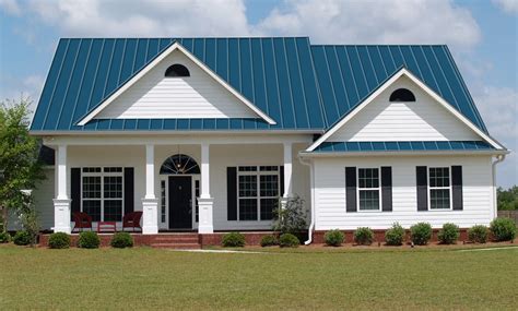 blue house white metal roof|blue siding with white shutters.